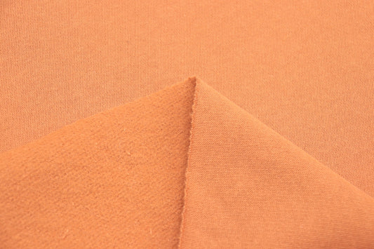 a close up of a plain orange fabric